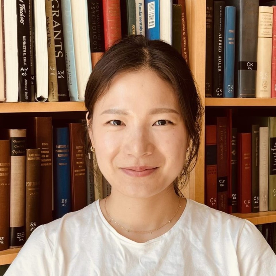 A portrait of Jiho Park in a library