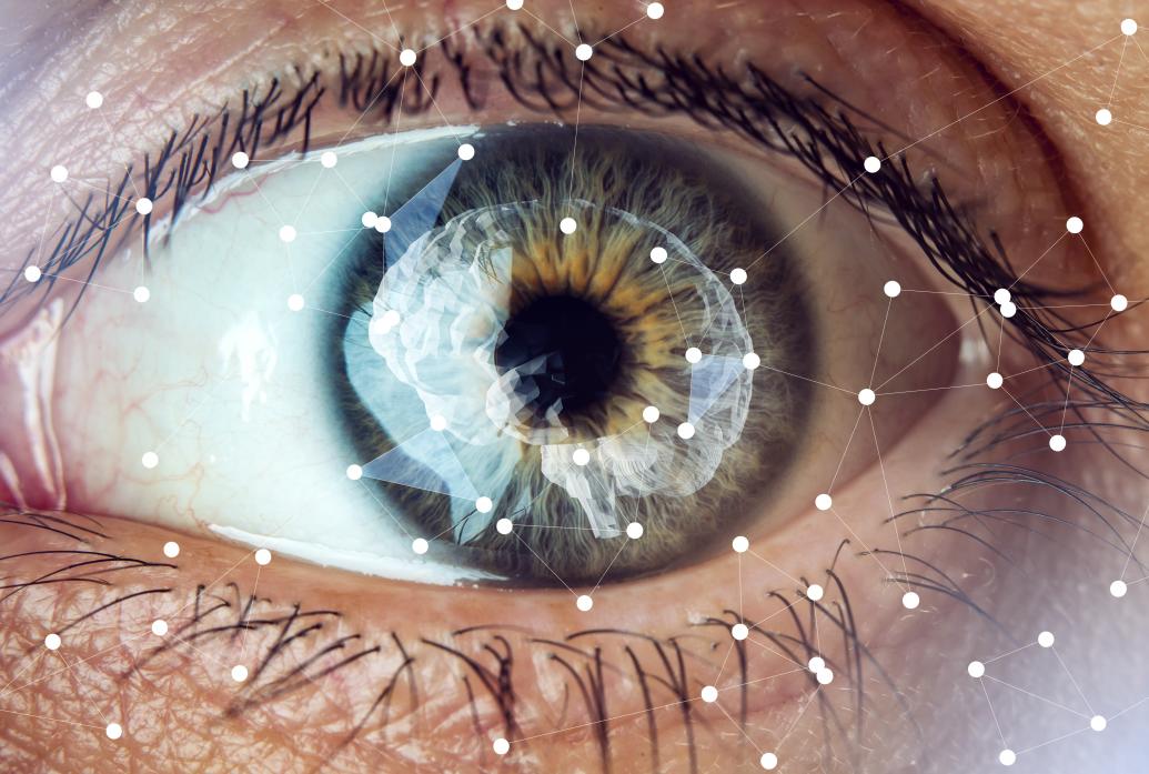 A closeup of an eye overlaid with white dots connected by thin lines and an image over the pupil of a brain