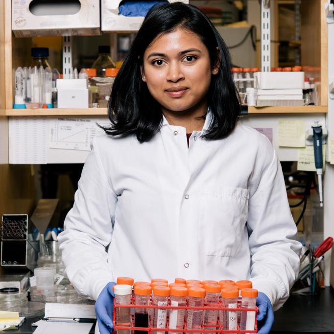 Scientist holding test tubes