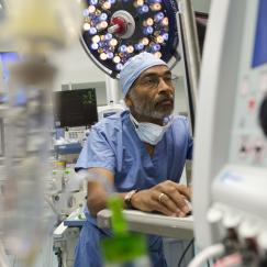 Emery Brown in an operating room setting wearing scrubs 