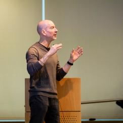 Earl Miller addresses a symposium audience