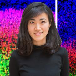A portrait of Gloria Choi is superposed over brightly stained images of mouse cortex